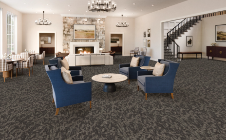 Commercial Carpet in a room with a fireplace, modern furniture, and cream walls